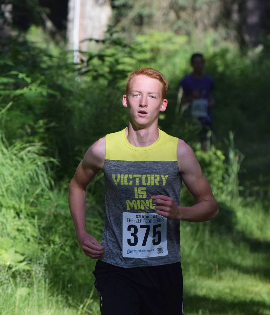 Anchor Musgrave leads the 5-kilometer field Saturday morning at the Soldotna Rotary Run at the Tsalteshi Trails. (Photo by Joey Klecka/Peninsula Clarion)