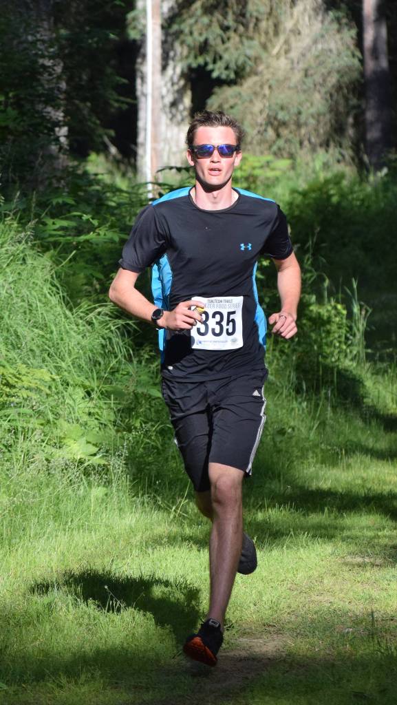John-Mark Pothast takes an early lead in the 10-kilometer race Saturday morning at the Soldotna Rotary Run at the Tsalteshi Trails. (Photo by Joey Klecka/Peninsula Clarion)