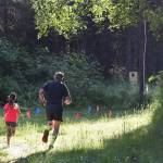 A pair of runners race through the woods Saturday morning in the 10-kilometer race at the Soldotna Rotary Run at the Tsalteshi Trails. (Photo by Joey Klecka/Peninsula Clarion)