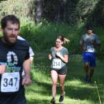 Courtney Stroh (214) makes her way along the Moose loop Saturday morning at the Soldotna Rotary Run at the Tsalteshi Trails. (Photo by Joey Klecka/Peninsula Clarion)
