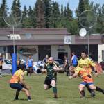 Kenai Wolfpack and Fairbanks SunDawgs players compete in a loser-out semifinal Saturday at the Between the Tides Dipfest Rugby 10s tournament at Spur View field in Kenai. (Photo by Joey Klecka/Peninsula Clarion)