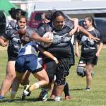 Aurora Rams player Tupe Aasa (with ball) tries to shed tackles from Anchortown players Saturday at the Between the Tides Dipfest Rugby 10s tournament at Spur View field in Kenai. (Photo by Joey Klecka/Peninsula Clarion)
