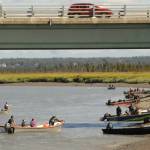 Personal-use dipnet fishermen pull up to the bank of the Kenai River beneath the Warren Ames Bridge on Saturday, July 21, 2018 in Kenai, Alaska. (Photo by Elizabeth Earl/Peninsula Clarion)