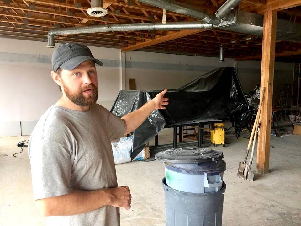 Todd Brigham stands in what will soon be The Compass youth centers cafe on Monday, in Nikiski. (Photo by Victoria Petersen/Peninsula Clarion)