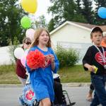 Participants in Heritage Places dispaly in the Progress Days parade chat as they make their way down Marydale Avenue on Saturday, July 28, 2018 in Soldotna, Alaska. The parade kicks off the weekend-long event celebrating Soldotnas history, with a market on Saturday and Sunday in Soldotna Creek Park and a concert Saturday night followed by a free community barbecue Sunday. (Photo by Elizabeth Earl/Peninsula Clarion)