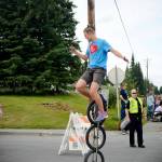 Josiah Martin of Soldotna deftly perches atop a unicycle during the Progress Days parade on Saturday, July 28, 2018 in Soldotna, Alaska. The parade kicks off the weekend-long event celebrating Soldotnas history, with a market on Saturday and Sunday in Soldotna Creek Park and a concert Saturday night followed by a free community barbecue Sunday. (Photo by Elizabeth Earl/Peninsula Clarion)