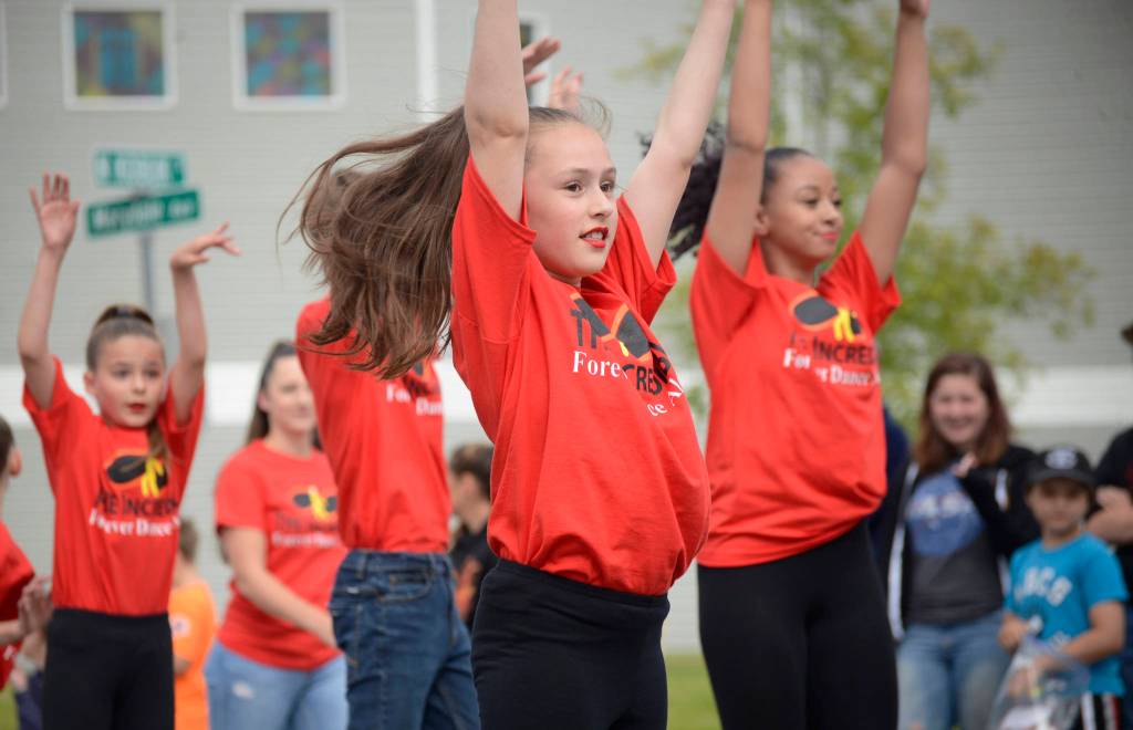 Dancers from studio Forever Dance Alaska perform a routine set to the theme of the Pixar film The Incredibles during the Progress Days parade on Marydale Avenue on Saturday, July 28, 2018 in Soldotna, Alaska. The parade kicks off the weekend-long event celebrating Soldotnas history, with a market on Saturday and Sunday in Soldotna Creek Park and a concert Saturday night followed by a free community barbecue Sunday. (Photo by Elizabeth Earl/Peninsula Clarion)