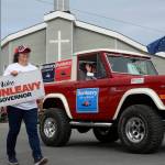 Volunteers for gubernatorial candidate Mike Dunleavys float in the Progress Days parade make their way down Marydale Avenue on Saturday, July 28, 2018 in Soldotna, Alaska. The parade kicks off the weekend-long event celebrating Soldotnas history, with a market on Saturday and Sunday in Soldotna Creek Park and a concert Saturday night followed by a free community barbecue Sunday. (Photo by Elizabeth Earl/Peninsula Clarion)