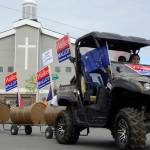 Volunteers for Gov. Bill Walkers gubernatorial reelection campaign float in the Progress Days parade make their way down Marydale Avenue on Saturday, July 28, 2018 in Soldotna, Alaska. The parade kicks off the weekend-long event celebrating Soldotnas history, with a market on Saturday and Sunday in Soldotna Creek Park and a concert Saturday night followed by a free community barbecue Sunday. (Photo by Elizabeth Earl/Peninsula Clarion)