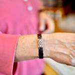 Hara Hansen shows off her horse hair bracelet, which was braided using hair from a horse of hers that recently passed away last year, on Friday, July 27, 2018, in Nikiski, Alaska. Horse hair accessories are one of Alaska Sea Glass newest products. (Photo by Victoria Petersen/Peninsula Clarion)