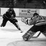 Photo by Dan Balmer Peninsula Clarion Kenai River Brown Bears forward Alec Butcher skates in on a breakaway with Austin Bruins goalie Nick Lehr defending in the second period Thursday at the Soldotna Regional Sports Complex. Butcher was denied on the scoring chance, but tallied a first period goal and an assist on the game-winner, which gave the Brown Bears a 4-3 victory over the Bruins.