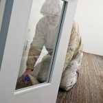 Photo by Rashah McChesney/Peninsula Clarion  Mike Gangloff works to clear paper off of the floor of a room he painted at the new Dena'ina Wellness Center Wednesday Jan. 29, 2014 in Kenai, Alaska.