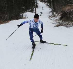 Photo by Jeff Helminak Soldotna High School's Addison Downing climbs a big hill near the start of Friday's boys five-kilometer freestyle at the Region III Nordic Ski Championships at Tsalteshi Trails.