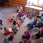 Photo by Rashah McChesney/Peninsula Clarion  Kenai National Wildlife Refuge education specialist Michelle Ostrowski reads to a group of kids during a class on mice, shrews and voles Thursday Feb. 20, 2014 in Soldotna, Alaska.