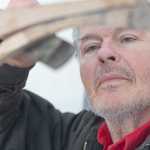 Photo by Rashah McChesney/Peninsula Clarion  Rod Perry does a bit of filing to fit a piece onto a wooden Iditarod sled he is building along with two friends Thursday Feb. 20, 2014 in Kasilof, Alaska.  The sled is much larger than any in use today and Perry said it was a replica of the type of sled originally used to haul freight, mail and passengers around the state.