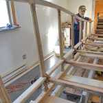 Photo by Rashah McChesney/Peninsula Clarion  Alan Perry stands near an Iditarod sled Thursday Feb. 20, 2014 that he is helping to build in Kasilof, Alaska. Perry and two companions are building the sled as a replica of those originally used to run freight along the Iditarod trail.