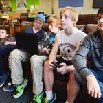 Photo by Rashah McChesney/Peninsula Clarion  (left) Hunter Bourgeois, 16, Andrew Slade, 15, Brent Christenson, 17, Tristan Wright, 17 and Ryan Kimball, 18 take turns playing Battlefield 4 Thursday Feb. 20, 2014 at the teen center in Soldotna, Alaska.