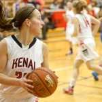 Photo by Rashah McChesney/Peninsula Clarion  Kenai's Hannah Barcus looks for an opening to pass after snagging a rebound during their game against Palmer Thursday Feb. 20, 2014 at Kenai Central High School in Soldotna, Alaska.