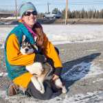 Photo by Rashah McChesney/Peninsula Clarion  Monica Zappa hugs her dog Dweezil Tuesday Feb. 25, 2014 at a stop in Kenai on her way to Anchorage for the ceremonial start of the Iditarod Trail Sled Dog Race. Zappa will be competing in the race for the first time.
