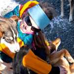 Photo by Rashah McChesney/Peninsula Clarion  Monica Zappa, of Ninilchik plays with three of her sled dogs Tuesday Feb. 25, 2014 in Kenai, Alaska. Zappa plans to race her team on the Iditarod Trail Sled Dog Race for the first time this year.