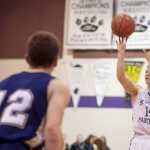 Photo by Rashah McChesney/Peninsula Clarion Skyview's Bailey Jones shoots from the three-point line during their game against Homer Friday Feb. 28, 2014 in Soldotna, Alaska.