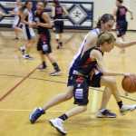 Photo by Rashah McChesney/Peninsula Clarion  Kenai's Allie Ostrander grabs a rebound during their game against Soldotna Saturday March 1, 2014 in Soldotna, Alaska.