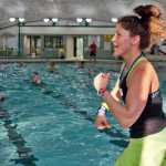 Photo by Rashah McChesney/Peninsula Clarion  Two kids played Saturday March 1, 2014 while an Aqua Zumba class was taught at the Nikiski Pool.