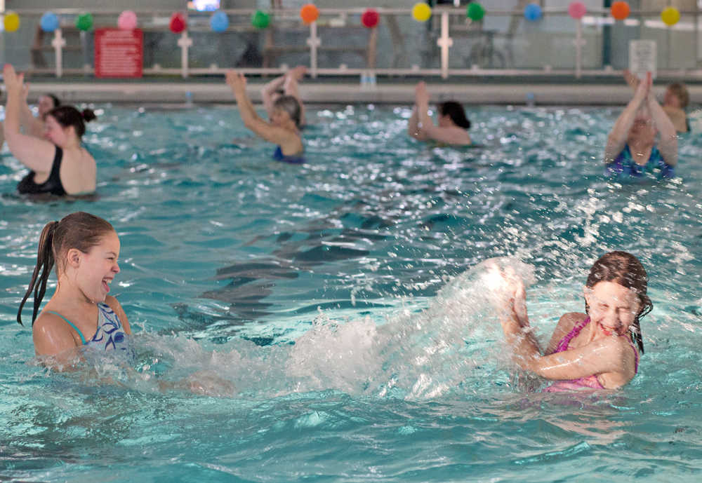Photo by Rashah McChesney/Peninsula Clarion  Charlotte Coots leads an Aqua Zumba class Saturday March 1, 2014 at the Nikiski Pool in Nikiski, Alaska. Typically the new class is held at the pool Tuesday and Thursday mornings, but Coots said the Saturday exhibition class was designed to raise awareness about the class.