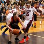 Photo by Rashah McChesney/Peninsula Clarion  Seldovia Sea Otter Seth O'Leary grabs a rebound and looks for an opening to pass during their game against the Nikolaevsk Warriors Friday March 7, 2014 at Skyview High School in Soldotna, Alaska.
