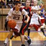 Photo by Rashah McChesney/Peninsula Clarion Nikolaevsk Warrior Nikit Fefelov grabs a rebound during their game against the Seldovia Sea Otthers Friday March 7, 2014 at Skyview High School in Soldotna, Alaska.