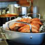 Photo by Rashah McChesney/Peninsula Clarion  A stack of fresh fry bread sits atop a stove Friday March 7, 2014 at Ft. Kenay in Kenai, Alaska. Volunteers said they'll sell 120 pieces of fry bread and another 120 piroshki if they sell out.