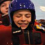 Donovan Orth, 14, struggles with his fellow classmates to stay in sync and swim forward as a group. Photo by Kelly Sullivan/ Peninsula Clarion