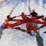 Students of the inagural Survival 101 spring break camp at the Challenger Center in Kenai learn how to make safety formations to conserve energy when stuck floating in cold water. Photo by Kelly Sullivan/ Peninsula Clarion