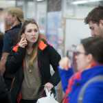 Photo by Rashah McChesney/Peninsula Clarion  One of several passengers in a group headed to Anchorage talks about obtaining a refund from United Airlines after flight 1425 was diverted to the Kenai Municipal Airport Friday and passengers were stranded for about 18 hours in Kenai, Alaska.  More than 100 passengers, many of whom slept on the floor of the airport, were told their overnight stay was necessary as the pilot and flight crew had exceeded the hours the Federal Aviation Administration allows them to fly.