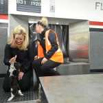 Photo by Rashah McChesney/Peninsula Clarion Ruthy Anderson and Shelby Turner, employees of Era Alaska airlines, play with four puppies that were deplaned at the Kenai Municipal Airport Friday evening and stayed in the airport some 18 hours until the flight could return Saturday March 15, 2014 to Anchorage, Alaska.