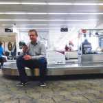 Photo by Rashah McChesney/Peninsula Clarion  Joe Dobrzynski waits for an announcement to board Saturday March 15, 2014 at the Kenai Municipal Airport in Kenai, Alaska. Dobrzynski and more than 100 other passengers were stranded at the Kenai aiport overnight after their United Airlines flight was diverted from Anchorage, Alaska.