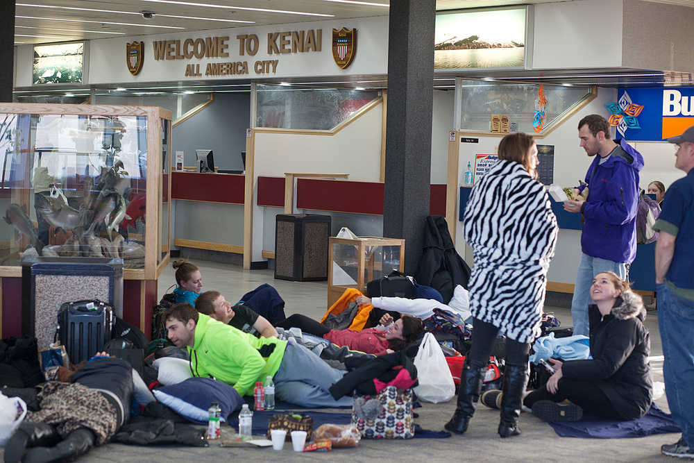 Photo by Rashah McChesney/Peninsula Clarion  A group of Alyeska-bound travellers camped out at the Kenai Municipal Airport after they and more than 100 other passengers were stranded for more than 18 hours when their United Airlines flight was diverted from Anchorage.