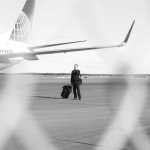Photo by Rashah McChesney/Peninsula Clarion A member of the United Airlines flight 1425 crew stands on the tarmac about Saturday March 15, 2014 as the plane waited at the Kenai Municipal Airport. Passengers and crew were stranded in Kenai for about 18 hours after their flight was diverted from Anchorage.
