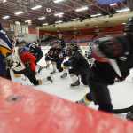 Photo by Rashah McChesney/Peninsula Clarion  The Kenai Peninsula Hockey Association girl's U16 team takes a knee during practice Friday March 14, 2014 at the Soldotna Sports Center in Soldotna, Alaska.