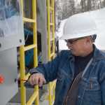 Photo by Rashah McChesney/Peninsula Clarion  Louis Cassens, a project engineer with Heartland Technology Partners, works on a leachate thermal evaporation unit Monday March 17, 2014 at the Central Peninsula Landfill in Soldotna, Alaska.