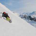 In a November 2013  photo provided by TwoSticksAndABoard.com, Sean Busby rides a mountain on the Hornstrandir peninsula of Iceland. By riding the highest mountain range in North Africa this year, Busby became the first person with Type 1 diabetes to snowboard on all seven continents. (AP Photo/TwoSticksAndABoard.com, Runar Karlsson)