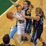 Nikiski sophomore Alison Litke (20) is defended by Valdez sophomores Madison Fleming, junior Veronica Hursh Rachel and a Buccaneers cheerleader during their 3A girls consolation bracket game in the ASAA state high school basketball tournament at Anchorage's Sullivan Arena on Friday.
