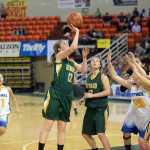 Seward High School junior Laura Kromrey scores against Bethel during their 3A girls consolation bracket game in the ASAA state basketball tournament at Anchorage's Sullivan Arena on Friday. Seward won 37-33. Seahawks teammate Maria Jackson (22) moves into the play.
