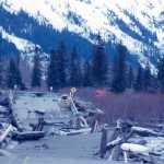 Alaska State Library,Alaska Earthquake Archives Committee, U.S. Army Photo,UAF-1972-153-350 The Seward Highway along Kenai Lake  on March 30, 1964 following the Alaska Earthquake and Tidal Wave. A view of cracked lake ice near Cooper Landing. The ground has collapsed beneath a length of railroad.