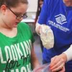Photo by Kelly Sullivan/ Peninsula Clarion Briley Morton prepares to start shaking her bag for handmade ice cream, Saturday, March 22, at WSTD in KPC.