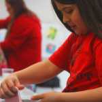 Claudia Martinex works on her hand made putty, Saturday, March 22, at WSTD in Soldotna.