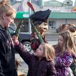 Photo by Rashah McChesney/Peninsula Clarion  Jesley Hanke looks at her daughter MacKinsey Hanke, 5, as Grayce Hanke, 8, plays with a wooden carving from Derrick Stanton Log Works in the background Tuesday March 25, 2014 in Soldotna, Alaska.