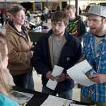 Photo by Rashah McChesney/Peninsula Clarion  (left) Joseph Garber and his brother Zachary Garber, both of Kasilof, talk to a representative from Peak Oilfield Services Wednesday March 26, 2014 during the Kenai Peninsula Job Fair in Kenai, Alaska.