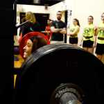 Photo by Rashah McChesney/Peninsula Clarion  Raquelle Reynolds, senior at Kenai Central High School, lifts 200 pounds during a Speed Strength Training competition Thursday March 26, 2014 at Nikiski High School in Nikiski, Alaska.
