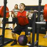 Photo by Rashah McChesney/Peninsula Clarion  Chase Logan, squats 385 pounds during a Speed Strength Training competition Thursday March 26, 2014 at Nikiski High School in Nikiski, Alaska.